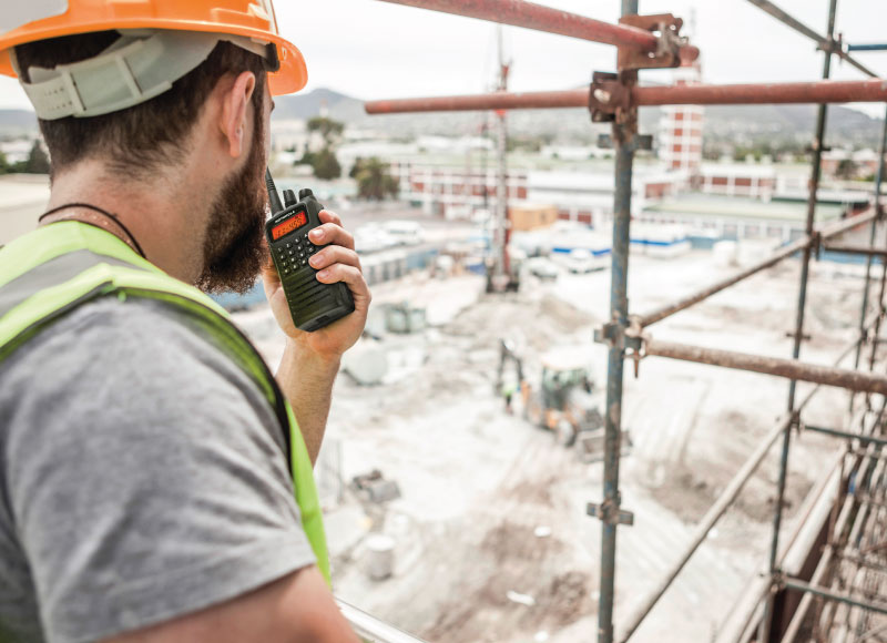 Engineer-with-a-two-way-radio-working-on-a-construction-site